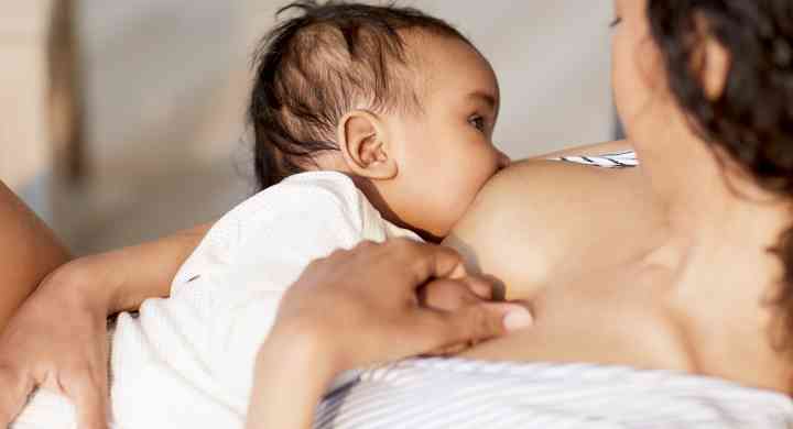Feeding Baby’s Microbiome: How Does Breastfeeding Influence The Gut-Brain Axis? Mother breastfeeding her baby